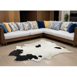 Photo of Black And White Cowhide Hand Knotted Area Rug