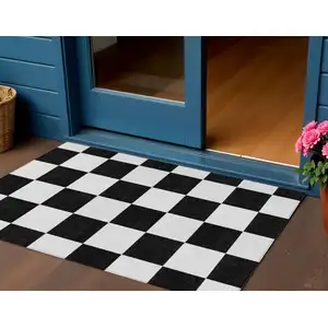 Photo of Black And White Geometric Washable Indoor Outdoor Area Rug
