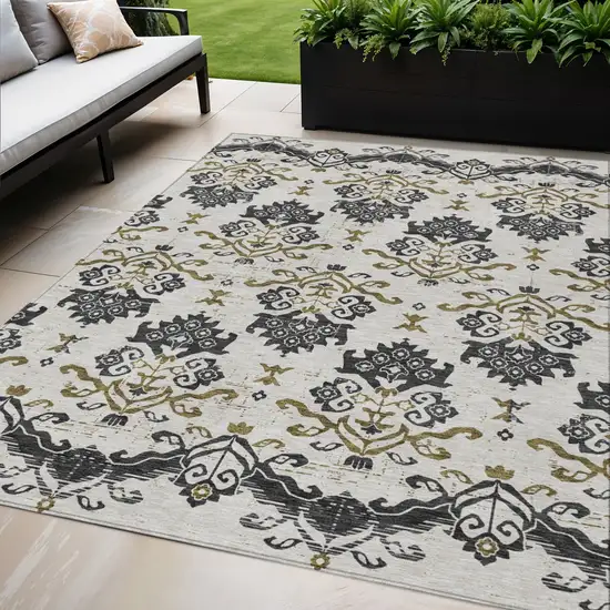 Black Beige And Gold Oriental Washable Indoor Outdoor Area Rug Photo 1