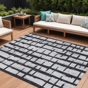 Photo of Black Beige And Gray Striped Washable Indoor Outdoor Area Rug