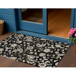 Photo of Black Beige And Ivory Floral Washable Indoor Outdoor Area Rug