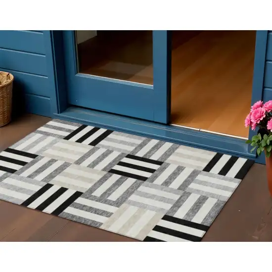 Black Beige And Ivory Geometric Washable Indoor Outdoor Area Rug Photo 1
