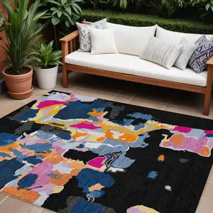 Photo of Black Blue And Pink Abstract Washable Indoor Outdoor Area Rug