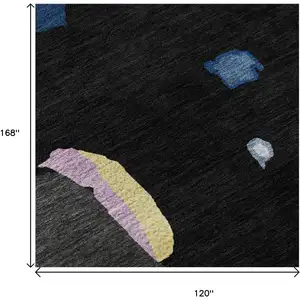 Photo of Black Blue Yellow And Pink Abstract Washable Area Rug With UV Protection