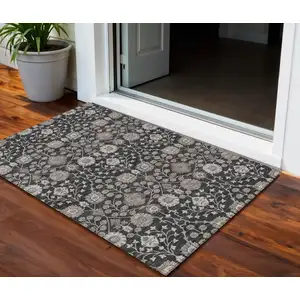 Photo of Black Brown And Beige Floral Washable Indoor Outdoor Area Rug