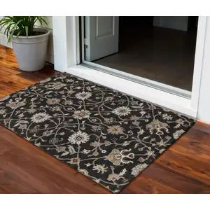 Photo of Black Brown And Ivory Floral Washable Indoor Outdoor Area Rug