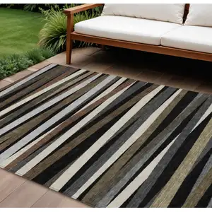 Photo of Black Brown And Ivory Striped Washable Indoor Outdoor Area Rug