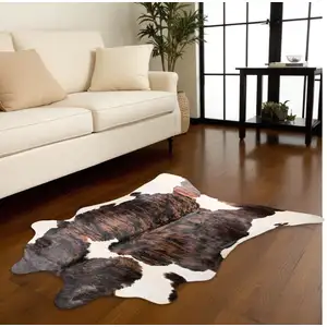 Photo of Black Brown And White Cowhide Hand Knotted Area Rug