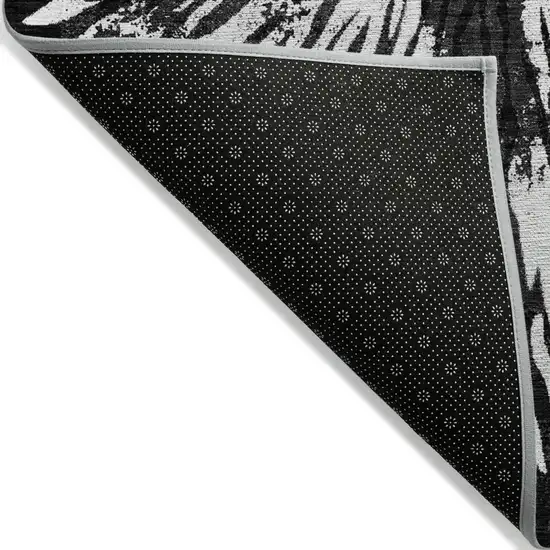 Black Charcoal And Ivory Abstract Washable Indoor Outdoor Area Rug Photo 4