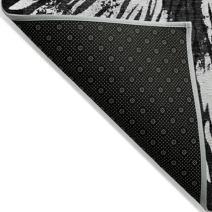 Black Charcoal And Ivory Abstract Washable Indoor Outdoor Area Rug Photo 4