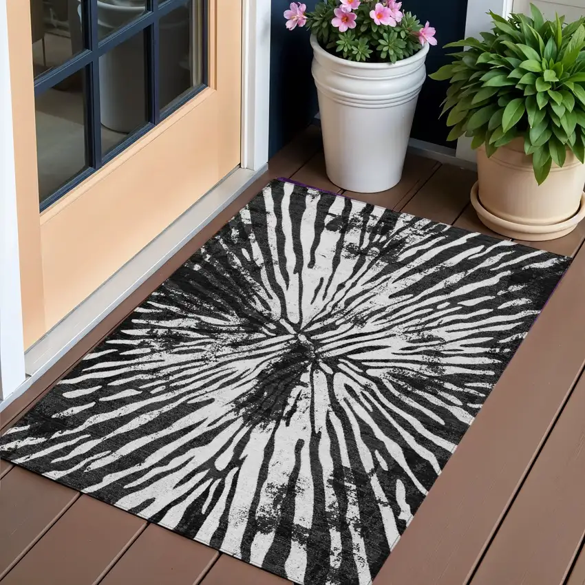 Black Charcoal And Ivory Abstract Washable Indoor Outdoor Area Rug Photo 1