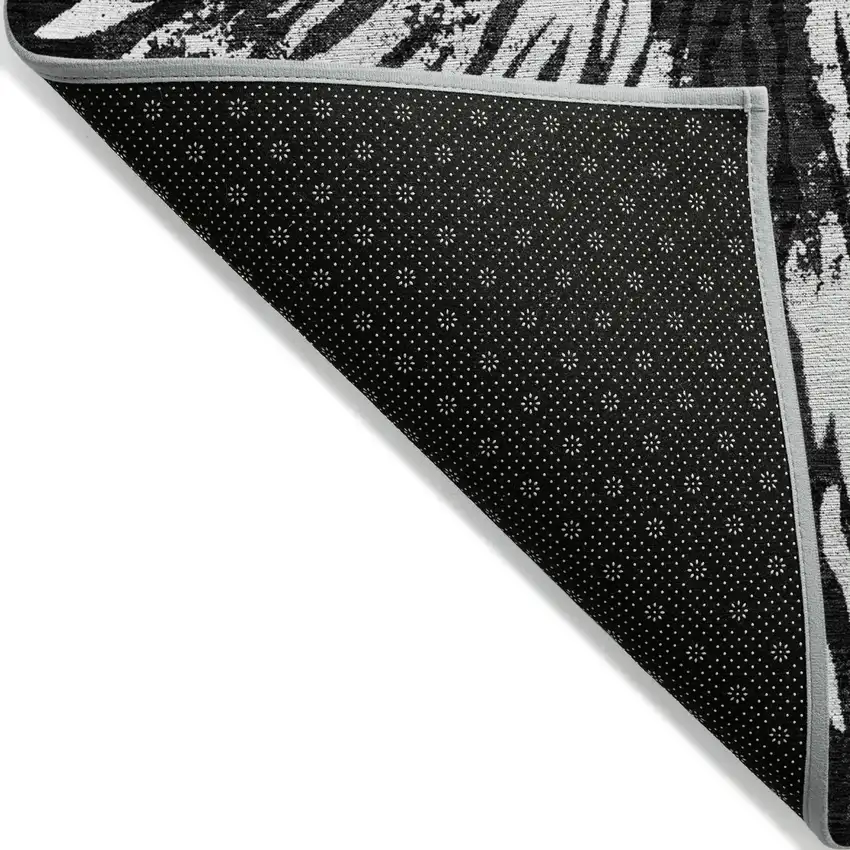 Black Charcoal And Ivory Abstract Washable Indoor Outdoor Area Rug Photo 4