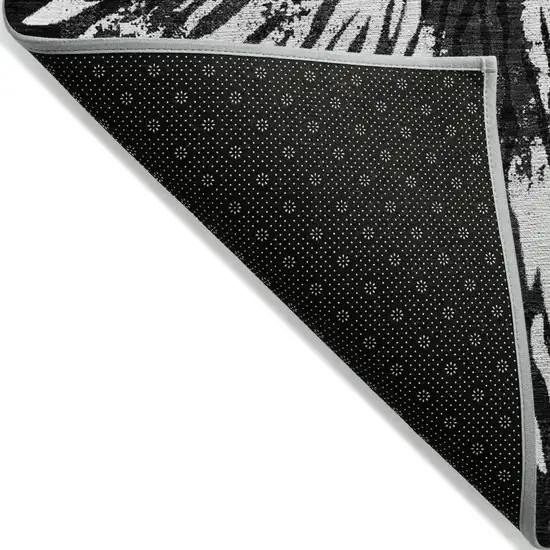 Black Charcoal And Ivory Abstract Washable Indoor Outdoor Area Rug Photo 4