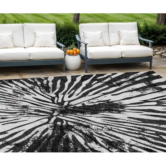 Black Charcoal And Ivory Abstract Washable Indoor Outdoor Area Rug Photo 1