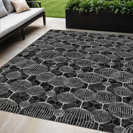 Black Charcoal And Ivory Geometric Washable Indoor Outdoor Area Rug Photo 1