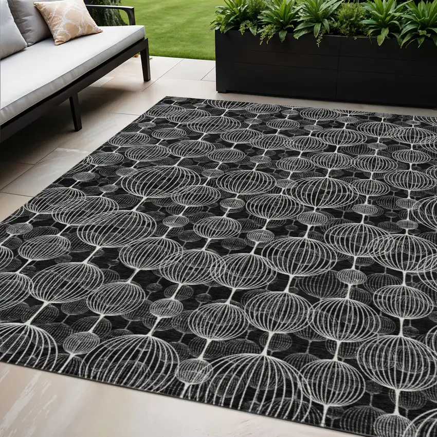 Black Charcoal And Ivory Geometric Washable Indoor Outdoor Area Rug Photo 1