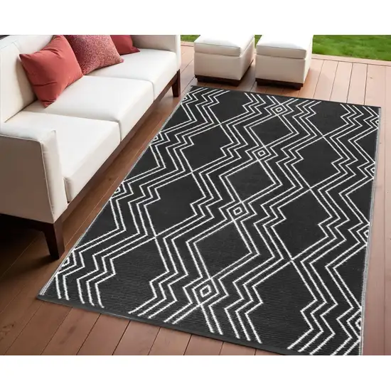 Black Geometric Machine Braided Distressed Area Rug With UV Protection Photo 1