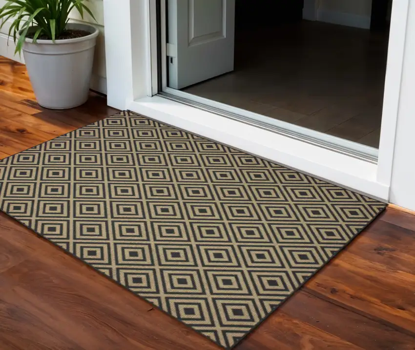 Black and Tan Geometric Stain Resistant Indoor Outdoor Area Rug Photo 1