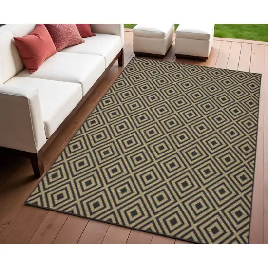 Black and Tan Geometric Stain Resistant Indoor Outdoor Area Rug Photo 1