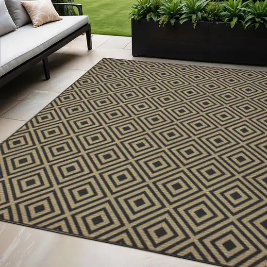 Black and Tan Geometric Stain Resistant Indoor Outdoor Area Rug Photo 1