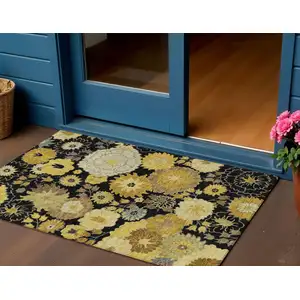 Photo of Black Gold And Beige Floral Washable Indoor Outdoor Area Rug