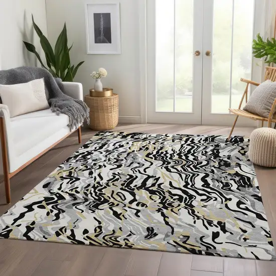 Black Gold And Ivory Abstract Washable Area Rug With UV Protection Photo 4
