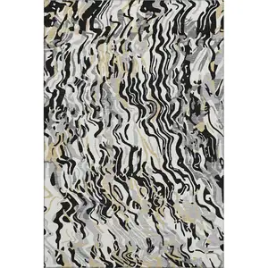 Photo of Black Gold And Ivory Abstract Washable Area Rug With UV Protection