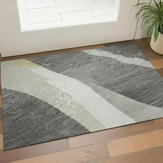 Black Gold And Ivory Abstract Washable Area Rug With UV Protection Photo 2