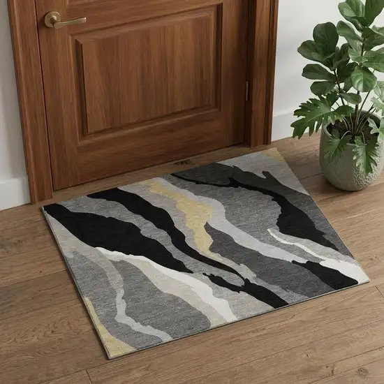 Black Gold And Ivory Abstract Washable Area Rug With UV Protection Photo 1