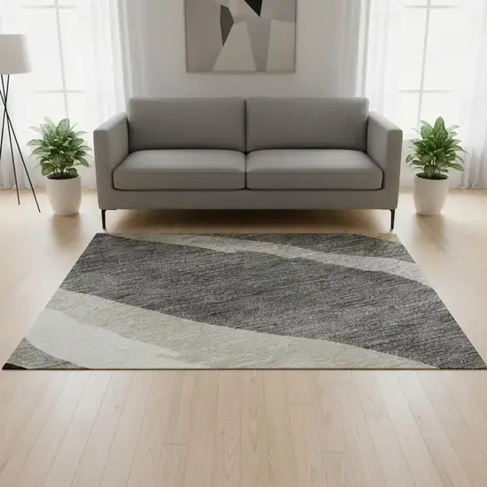 Black Gold And Ivory Abstract Washable Area Rug With UV Protection Photo 2