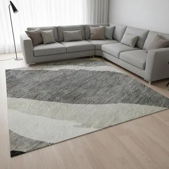 Black Gold And Ivory Abstract Washable Area Rug With UV Protection Photo 2