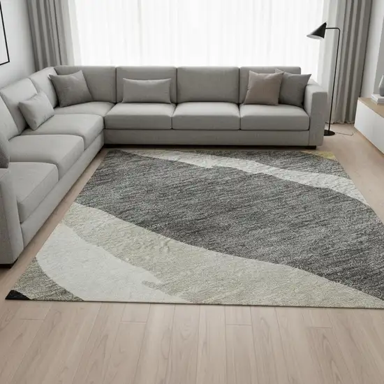 Black Gold And Ivory Abstract Washable Area Rug With UV Protection Photo 2