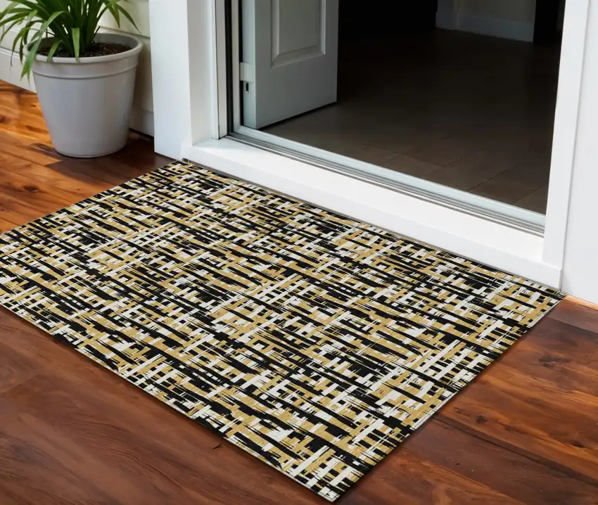 Black Gold And Ivory Abstract Washable Indoor Outdoor Area Rug Photo 1