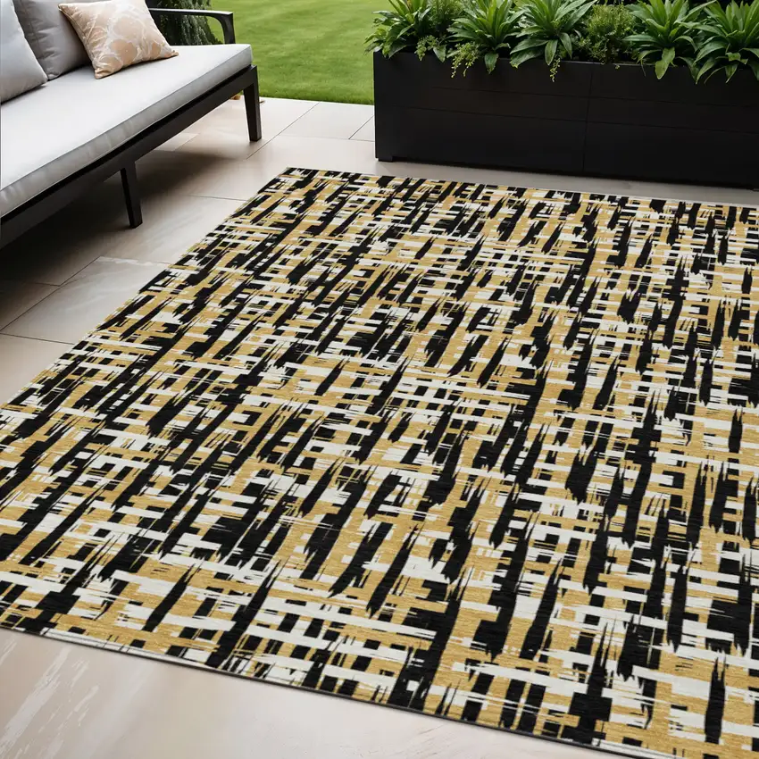 Black Gold And Ivory Abstract Washable Indoor Outdoor Area Rug Photo 1