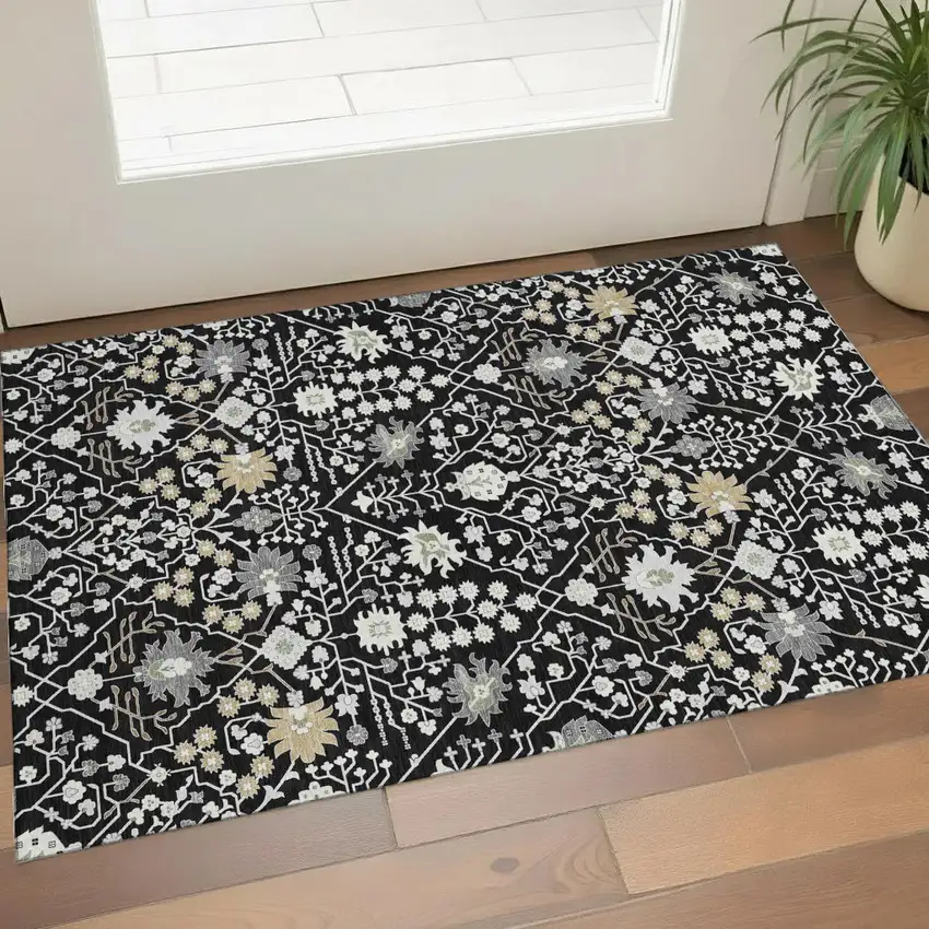 Black Gold And Ivory Oriental Washable Area Rug With UV Protection Photo 1
