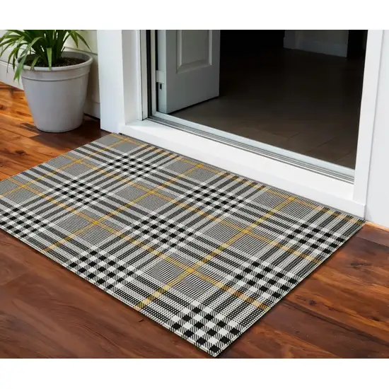 Black Gold And Ivory Plaid Washable Indoor Outdoor Area Rug Photo 1