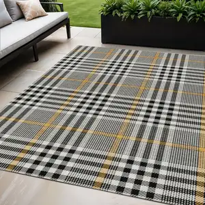 Photo of Black Gold And Ivory Plaid Washable Indoor Outdoor Area Rug