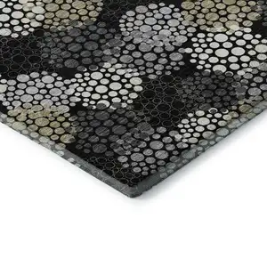 Photo of Black Gold And Ivory Polka Dot Washable Area Rug With UV Protection