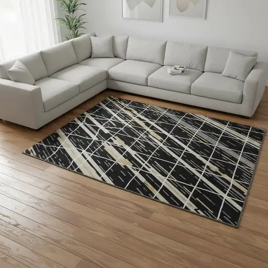 Black Gold And Ivory Striped Washable Area Rug With UV Protection Photo 2
