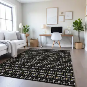 Photo of Black Gold And Silver Striped Washable Area Rug With UV Protection