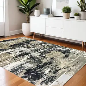 Photo of Black Gold Grey And Ivory Abstract Power Loom Stain Resistant Area Rug