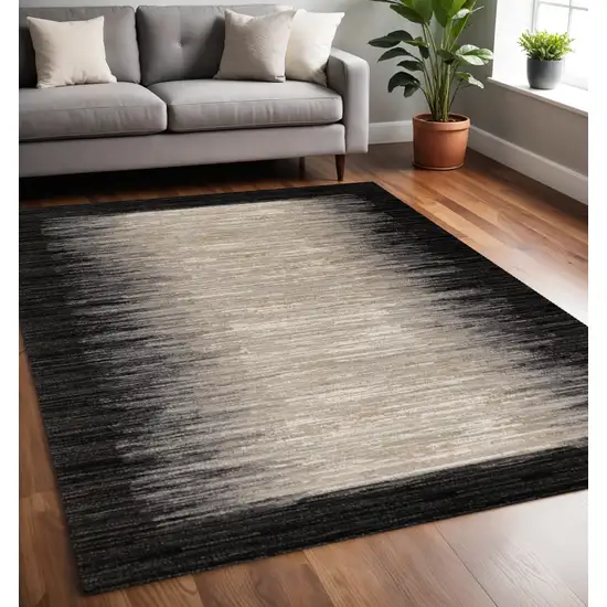 Black Gray And Beige Abstract Area Rug Photo 1