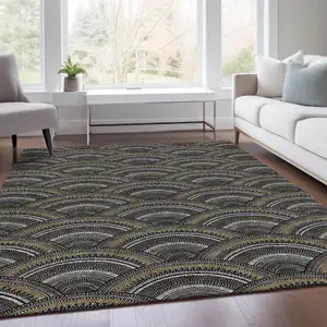 Photo of Black Gray And Gold Geometric Washable Area Rug With UV Protection