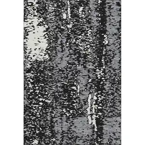 Photo of Black Gray And Ivory Abstract Washable Area Rug With UV Protection