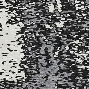 Photo of Black Gray And Ivory Abstract Washable Area Rug With UV Protection
