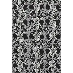 Photo of Black Gray And Ivory Abstract Washable Area Rug With UV Protection