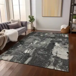 Photo of Black Gray And Ivory Abstract Washable Indoor Outdoor Area Rug