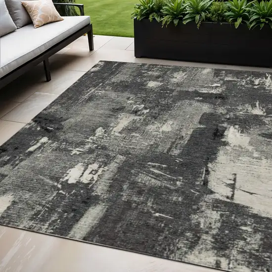Black Gray And Ivory Abstract Washable Indoor Outdoor Area Rug Photo 1