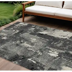Photo of Black Gray And Ivory Abstract Washable Indoor Outdoor Area Rug