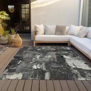 Photo of Black Gray And Ivory Abstract Washable Indoor Outdoor Area Rug